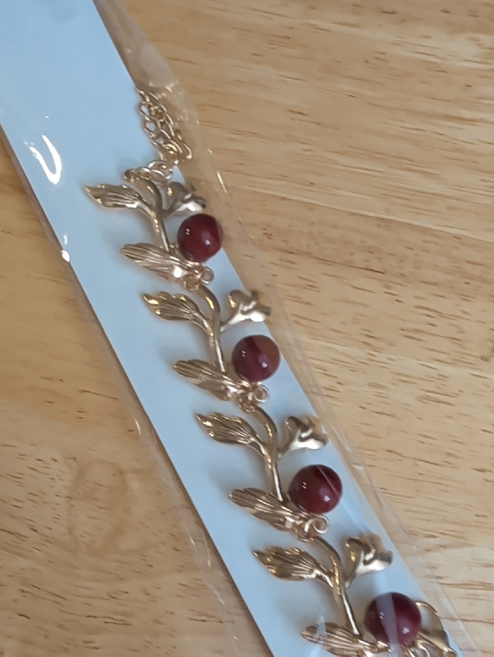 Gold Tone Leaf Bracelet with Burgundy Beads